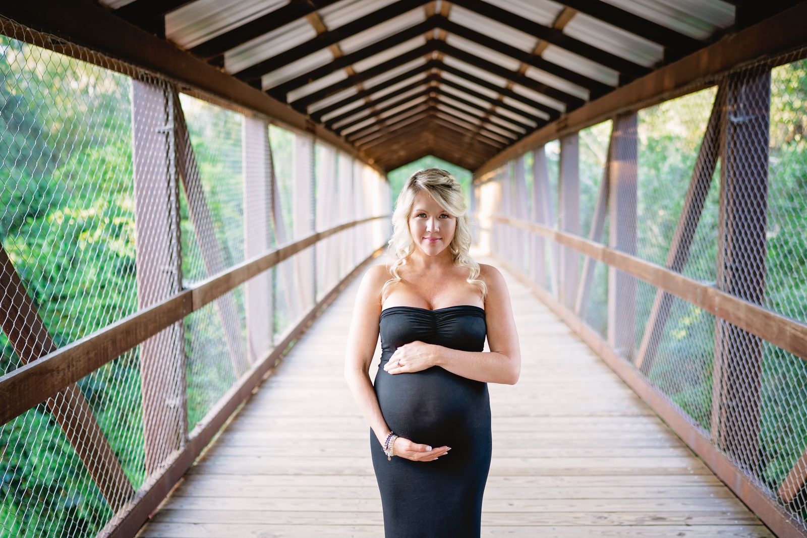 Maternity portrait on the covered wooden bridge at Tom Brown Park, Tallahassee
