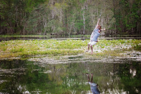Playful moment among the green aquatic plants on the Wacissa River near Tallahassee